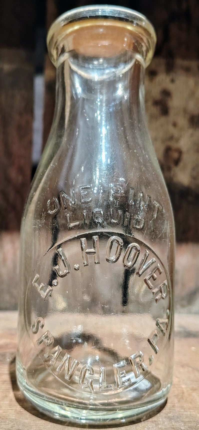 E.J. Hoover dairy bottle with embossed glass